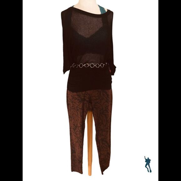 Black dolman sleeve gathers at waist line. This top it has small peekaboo holes. - Picture 2 of 3